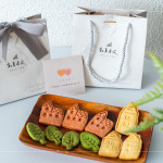 伴手禮贈(zèng)送『迦南園烘焙庇護(hù)工場(chǎng)』的公益餅乾，可愛(ài)、溫馨兼顧著美味，為這場(chǎng)活動(dòng)增添一份愛(ài)的溫度。
